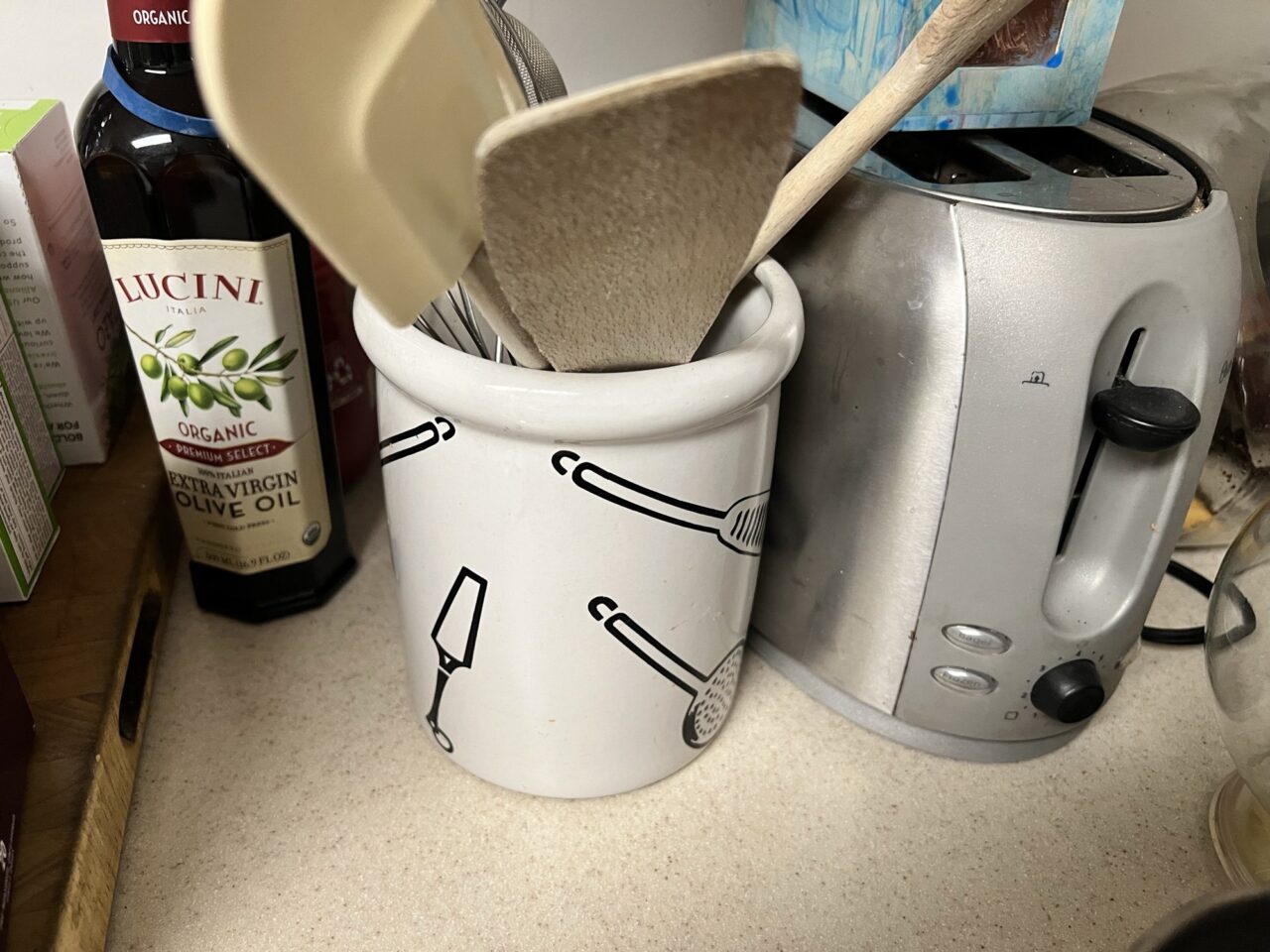 Utensil crock with wooden spoons