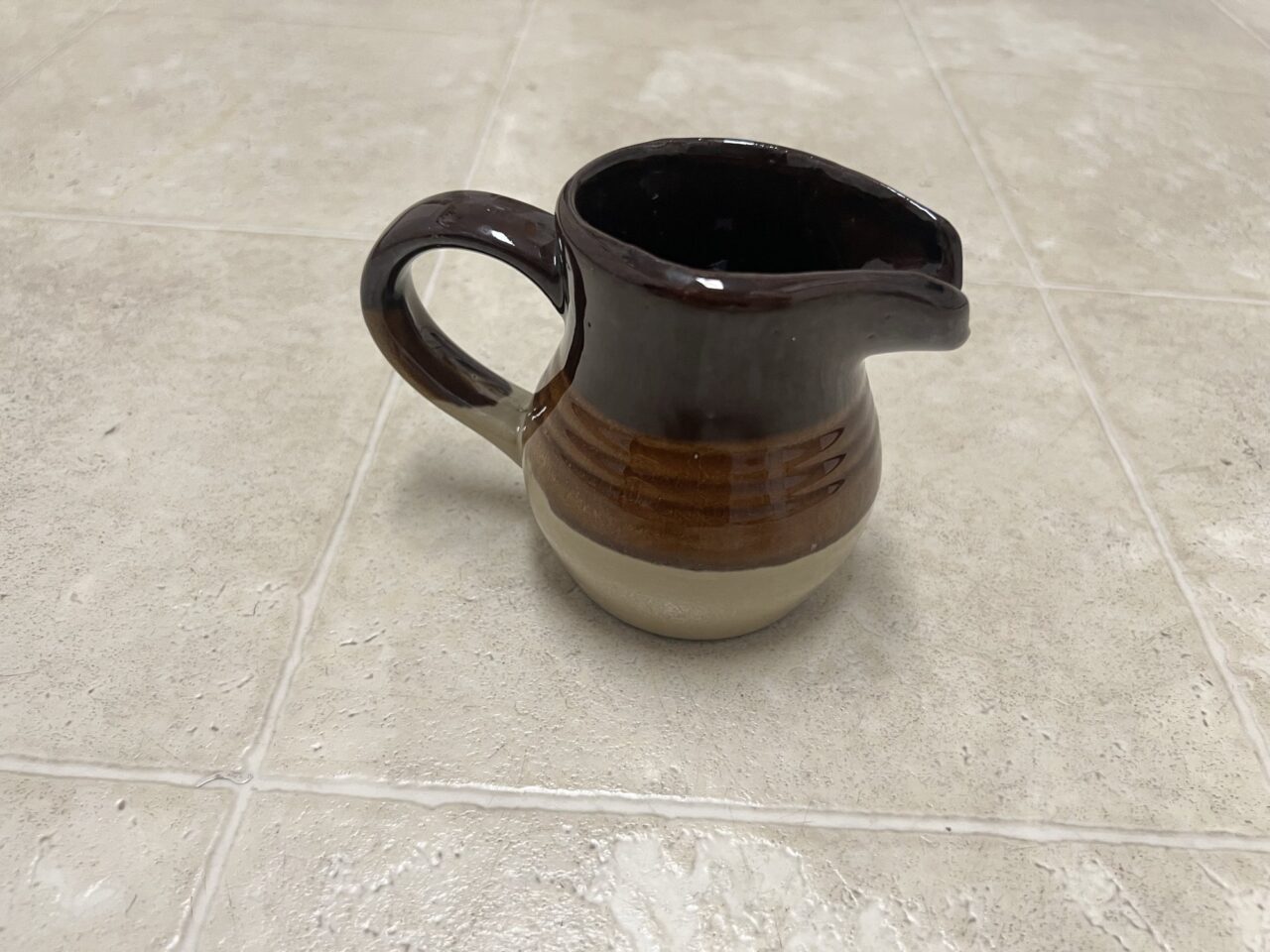 Brown stoneware creamer