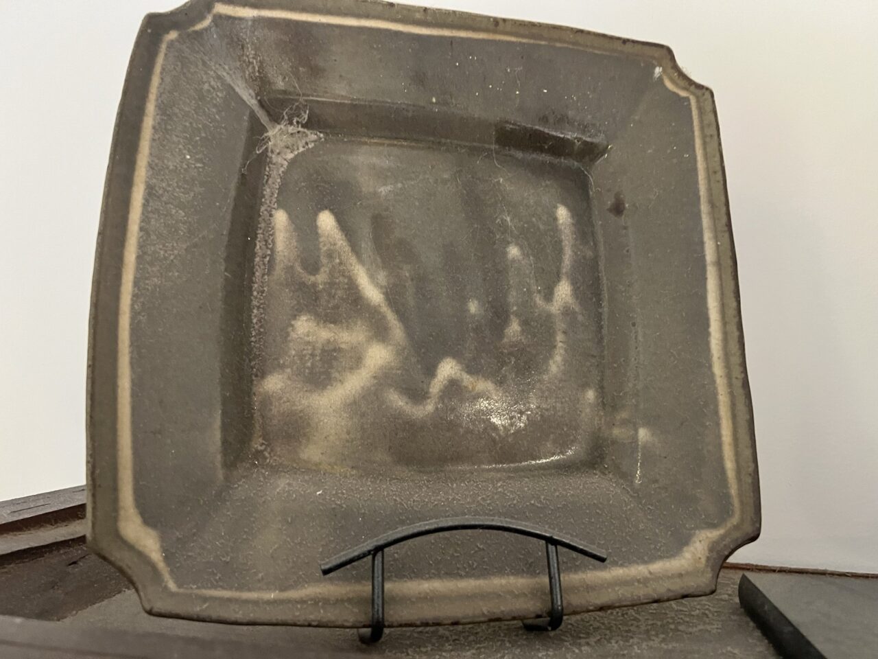 Square pottery platter on stand