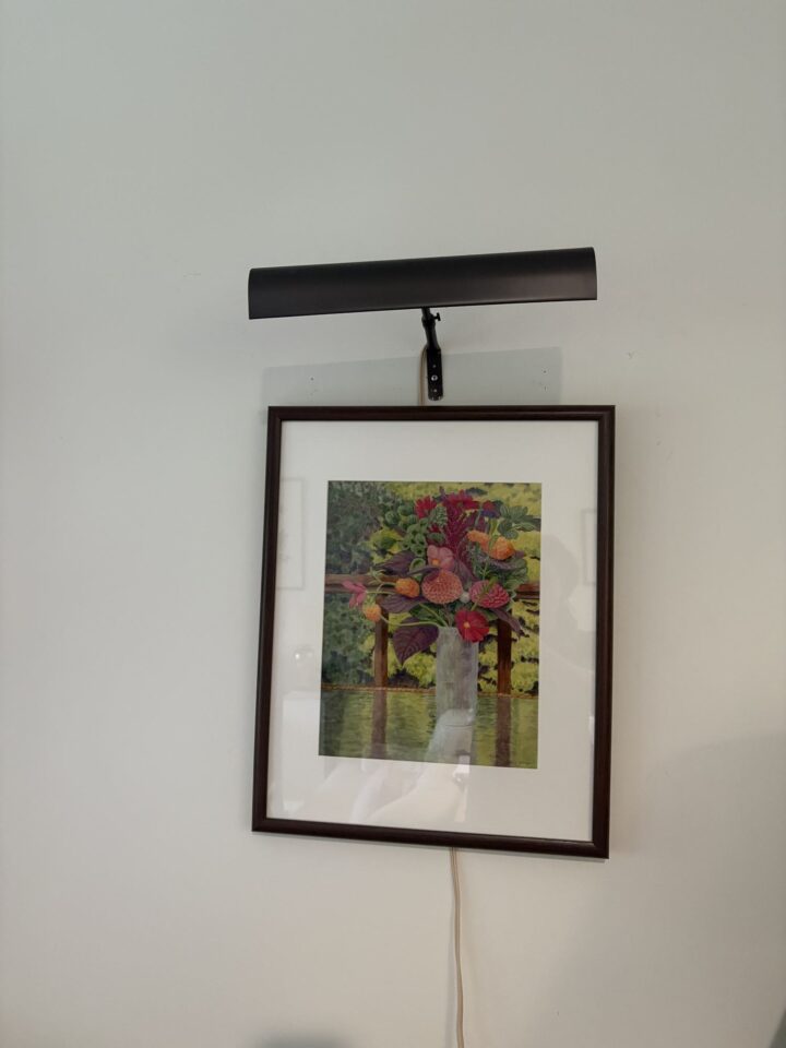 Framed flower print with picture light